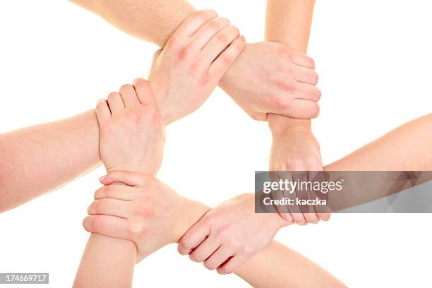 unite - wrist stock pictures, royalty-free photos & images