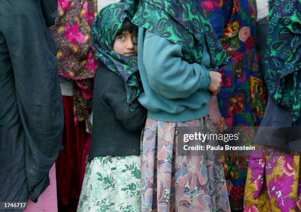 afghan childen eat at orphanage - afghan girl stock pictures, royalty-free photos & images