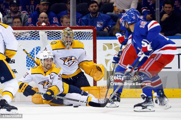 Roman Josi and Juuse Saros of the Nashville Predators defend against the New York Rangers at Madison Square Garden on October 19, 2023 in New York...