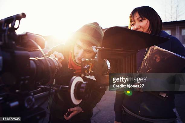 changing lenses - tv crew stock pictures, royalty-free photos & images