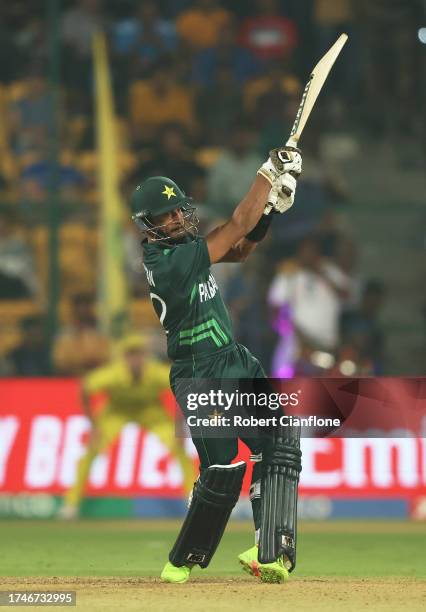 Hasan Ali of Pakistan plays a shot during the ICC Men's Cricket World Cup India 2023 between Australia and Pakistan at M. Chinnaswamy Stadium on...