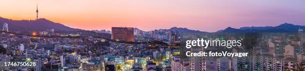 seoul skyscraper sunset aerial panorama over illuminated cityscape korea - n seoul tower stock pictures, royalty-free photos & images