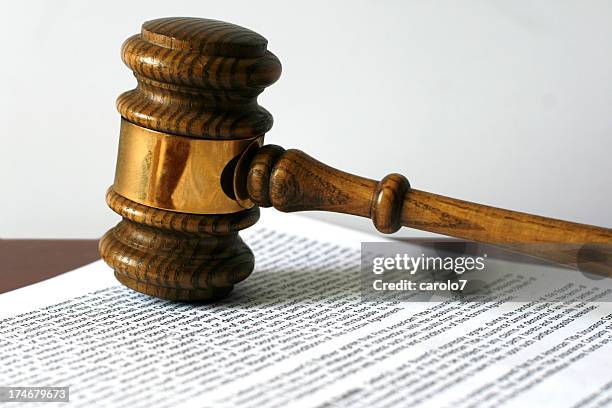 gavel on document. - legal document stock pictures, royalty-free photos & images