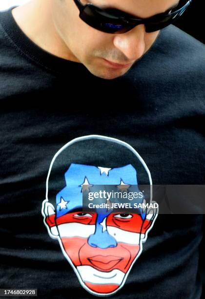 Supporter of Democratic presidential candidate Barack Obama arrives to watch the televised final presidential debate between Obama and Republican...