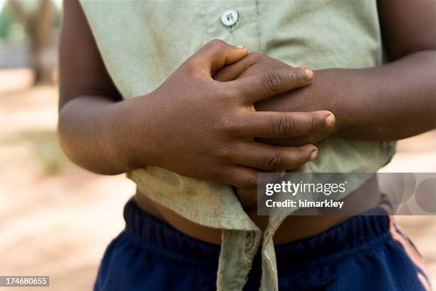 hunger - stomach child stock pictures, royalty-free photos & images