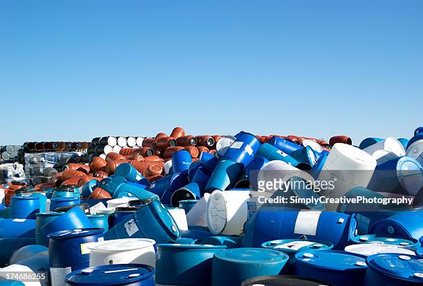 plastic barrels to the horizon - drums stock pictures, royalty-free photos & images
