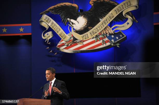 Democratic presidential nominee Barack Obama takes part in the first debate of the 2008 elections with Republican presidential nominee John McCain at...