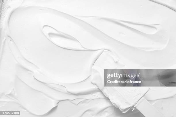 spreading cake frosting - fondant stock pictures, royalty-free photos & images