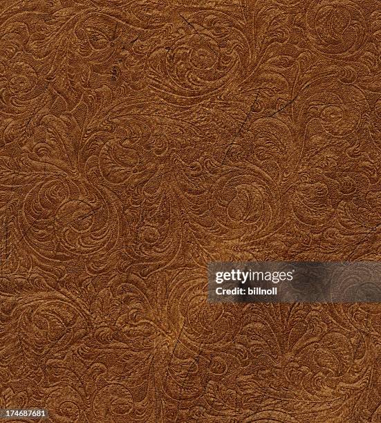 scroll engraved on vintage leather - leather background stock pictures, royalty-free photos & images