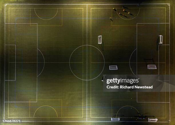 floodlit football training - yard line stock pictures, royalty-free photos & images