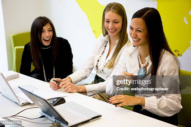 laughing businesswomen - travel agent stock pictures, royalty-free photos & images