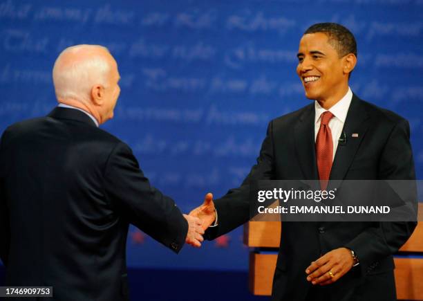 Republican presidential nominee John McCain shakes hands with Democratic presidential nominee Barack Obama September 26, 2008 following the first...