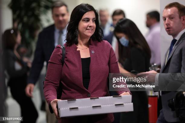 Rep. Nicole Malliotakis carries pizza as she leaves a closed-door House Republican meeting at the U.S. Capitol on October 20, 2023 in Washington, DC....