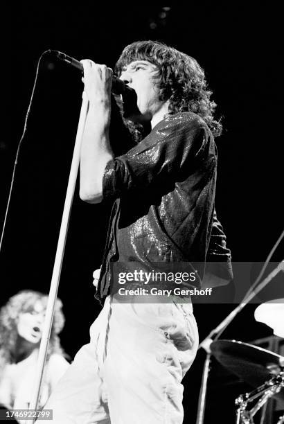 English Rock singer Joe Elliott, of the group Def Leppard, performs onstage at Nassau Coliseum , Uniondale, New York, August 14, 1981. Visible in the...