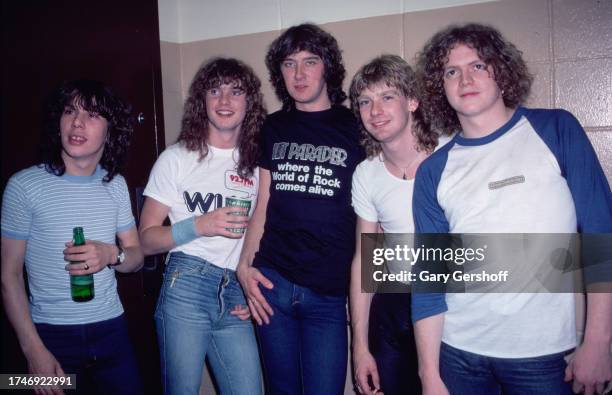 View of members of the English Rock group Def Leppard as they pose backstage following a performance at Nassau Coliseum , Uniondale, New York, August...