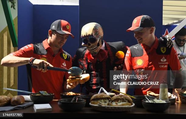 Ferrari's Charles Leclerc and reserve driver Robert Shwartzman prepare a Torta de Chilaquiles¨ at the paddock, ahead of the upcomig Formula One...