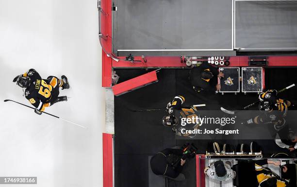 Kris Letang, Sidney Crosby and Evgeni Malkin of the Pittsburgh Penguinsat take the ice against the Colorado Avalanche PPG PAINTS Arena on October 26,...