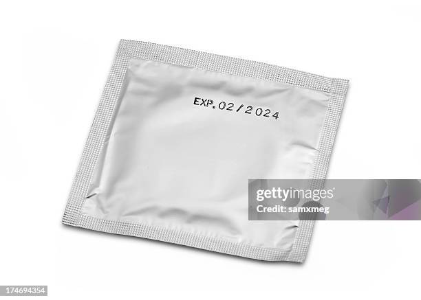 packed condom (clipping paths) - condom stock pictures, royalty-free photos & images