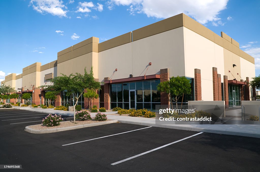 Bright colored photo of parking lot and office building