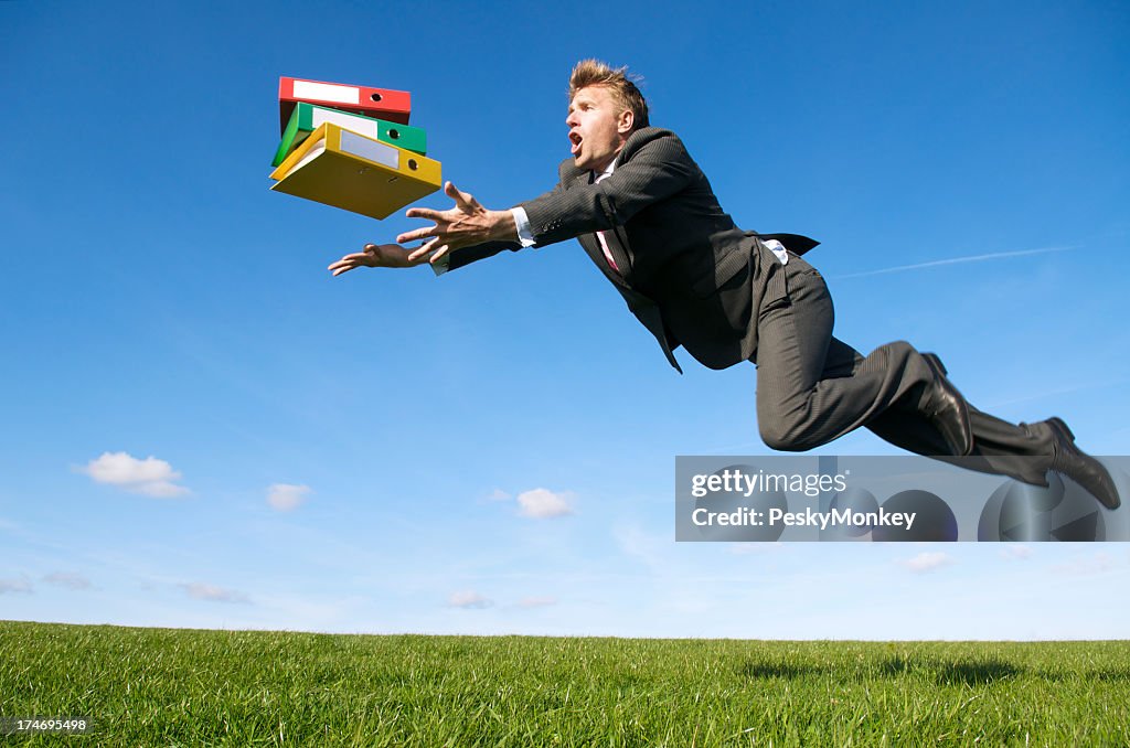 Stressed Businessman Tripping Outdoors Green Meadow for File Folders