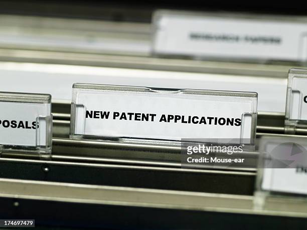 patent applications suspension file - intellectueel eigendom stockfoto's en -beelden