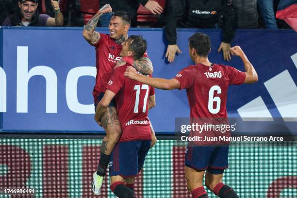 Ante Budimir of CA Osasuna celebrates with his teammate Chimy Avila of CA Osasuna after scoring the first goal during the LaLiga EA Sports match...