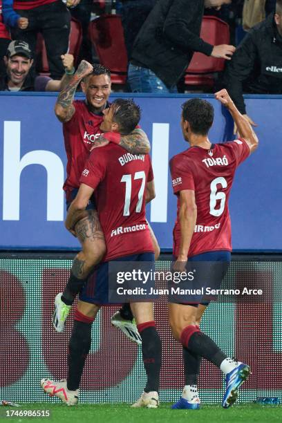 Ante Budimir of CA Osasuna celebrates with his teammate Chimy Avila of CA Osasuna after scoring the first goal during the LaLiga EA Sports match...
