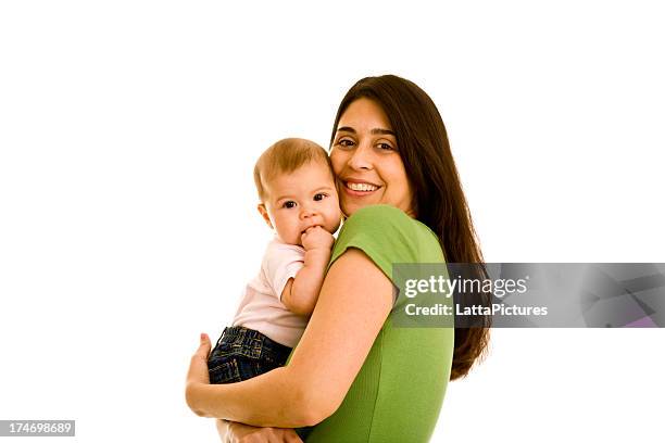 hispanic smiling female hugging infant looking at camera - mother holding baby white background stock pictures, royalty-free photos & images