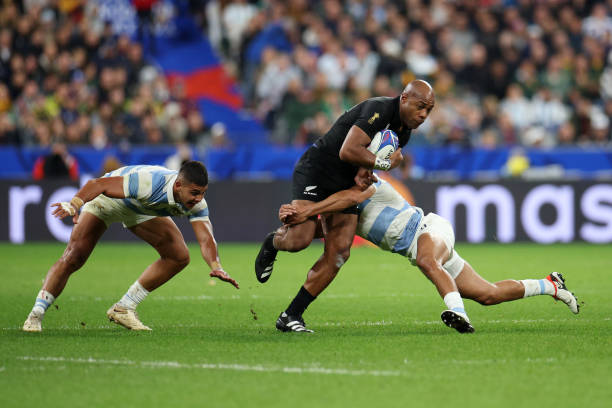 Mark Telea of New Zealand is tackled by Santiago Carreras of Argentina during the Rugby World Cup France 2023 semi-final match between Argentina and...
