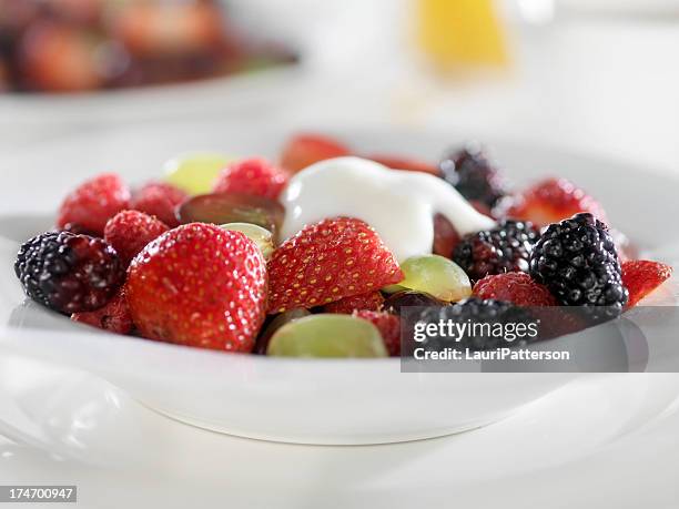 mixed berries with yogurt - fruit salad stock pictures, royalty-free photos & images