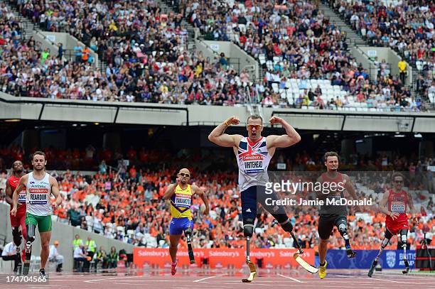 Richard Whitehead of Great Britain celebrates as he crosses the line first in the Mens T42 200mduring day three of the Sainsbury's Anniversary Games...