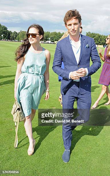 Lara Pulver and Eddie Redmayne attend the Audi International Polo at Guards Polo Club on July 28, 2013 in Egham, England.