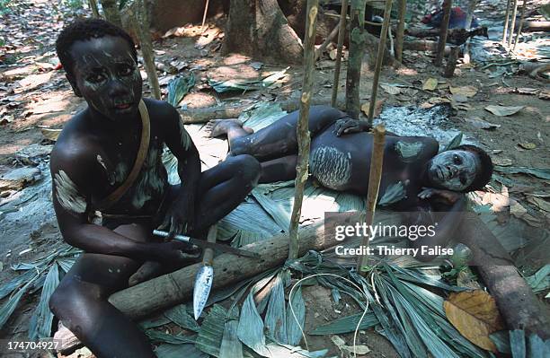 Ugna, a young pregnant woman, with her husband..