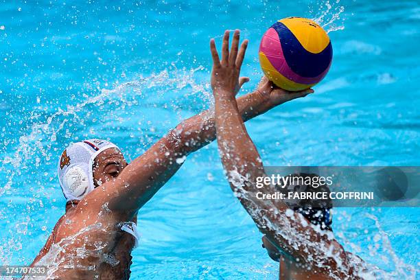 Serbia's Vanja Udovicic vies with Romania's Petru Ianc during their men's water polo quarterfinals qualification match at the FINA World...