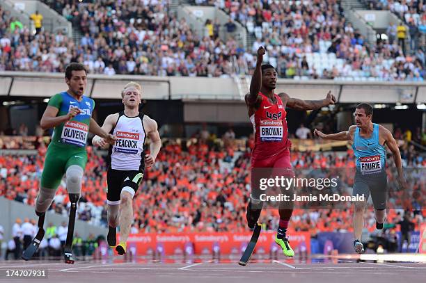 Alan Oliveira of Brazil crosses the line ahead of Jonnie Peacock of Great Britain, Richard Browne of United States and Arnu Fourie of South Africa in...