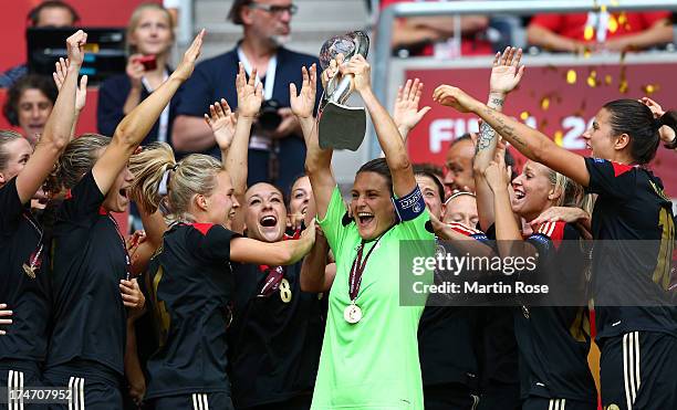 Nadine Angerer , goalkeeper of Germany lifts the trophy after the UEFA Women's EURO 2013 final match between Germany and Norway at Friends Arena on...