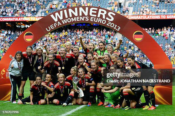 Germany's players celebrate with the trophy after winning the UEFA Women's European Championship Euro 2013 final Germany vs Norway on July 28, 2013...