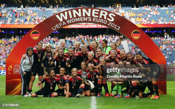 The team of Germany celebrate after winning the UEFA Women's EURO 2013 final match between Germany and Norway at Friends Arena on July 28, 2013 in...