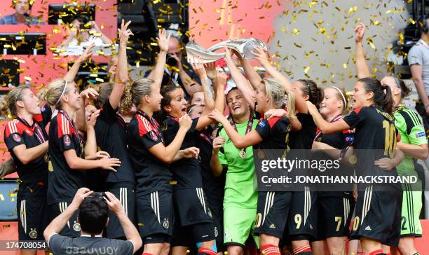 Germany's players celebrate with the trophy after winning the UEFA Women's European Championship Euro 2013 final Germany vs Norway on July 28, 2013...