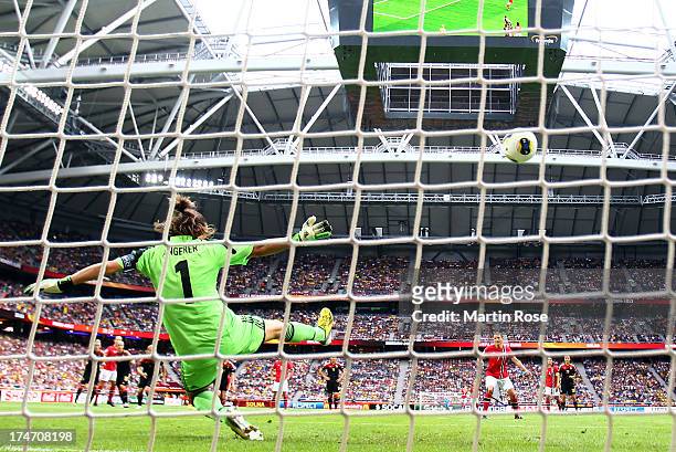 Nadine Angerer , goalkeeper of Germany saves the penalty shot of Trine Roenning of Norway during the UEFA Women's EURO 2013 final match between...