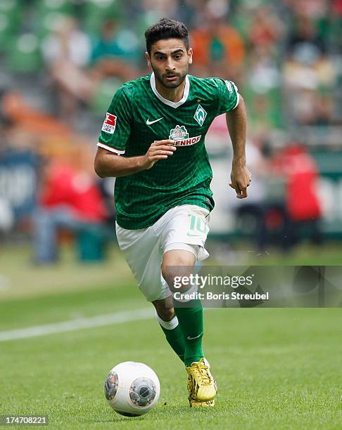 Mehmet Ekici of Bremen runs with the ball during the pre-season friendly match between Werder Bremen and Fulham at Weser Stadium on July 28, 2013 in...