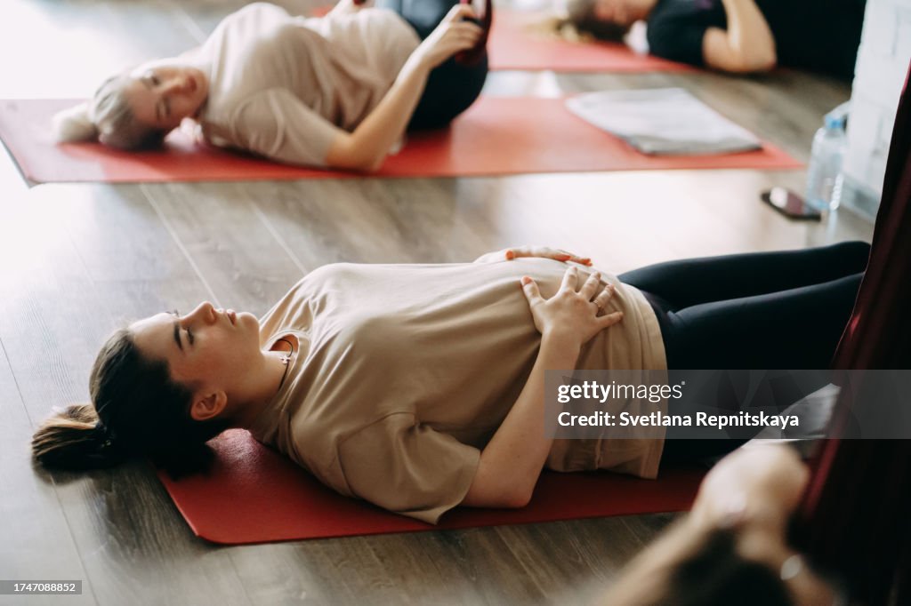 Pregnant women in a yoga class with an instructor
