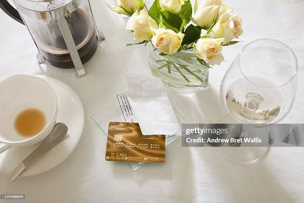 Restaurant table with bill and credit card