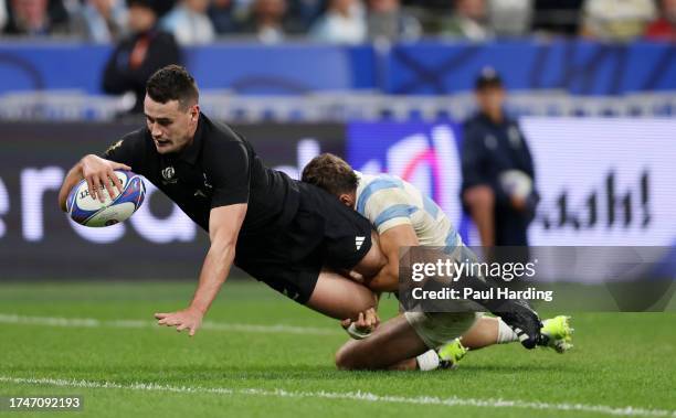 Will Jordan of New Zealand scores the team's seventh try, completing his hat-trick during the Rugby World Cup France 2023 semi-final match between...