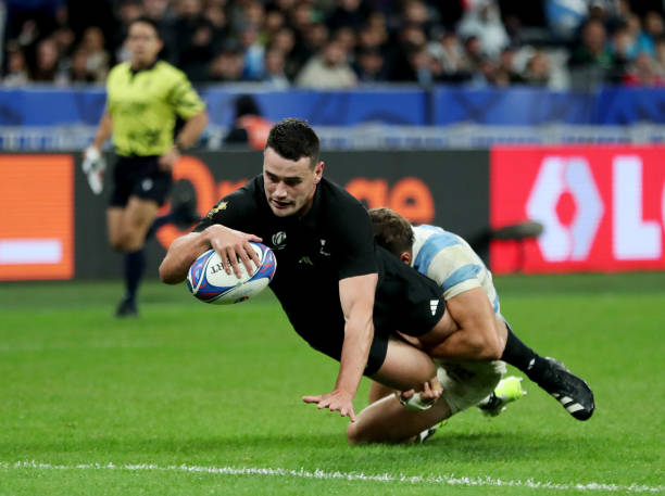 Will Jordan of New Zealand scores his team's seventh try whilst being challenged by Juan Cruz Mallia of Argentina during the Rugby World Cup France...