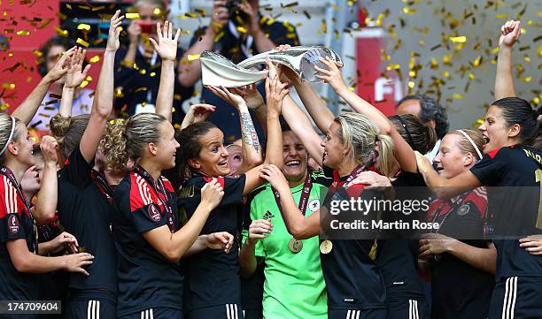 The team of Germany celebrate after winning the UEFA Women's EURO 2013 final match between Germany and Norway at Friends Arena on July 28, 2013 in...