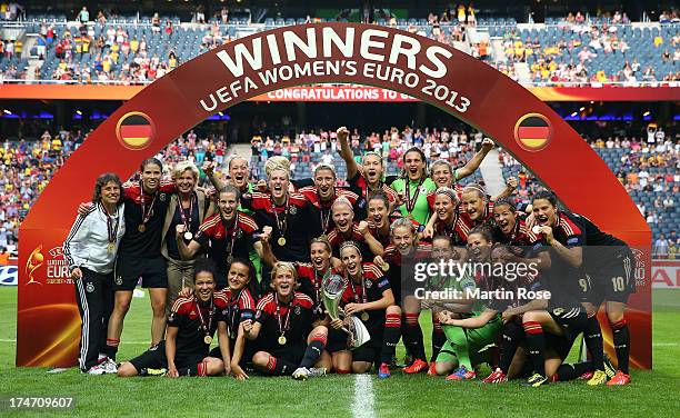 The team of Germany celebrate after winning the UEFA Women's EURO 2013 final match between Germany and Norway at Friends Arena on July 28, 2013 in...