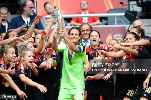 Germany's players celebrate with the trophy after winning the UEFA Women's European Championship Euro 2013 final Germany vs Norway on July 28, 2013...