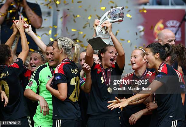 Lena Lotzen of Germany lifts the trophy after the UEFA Women's EURO 2013 final match between Germany and Norway at Friends Arena on July 28, 2013 in...