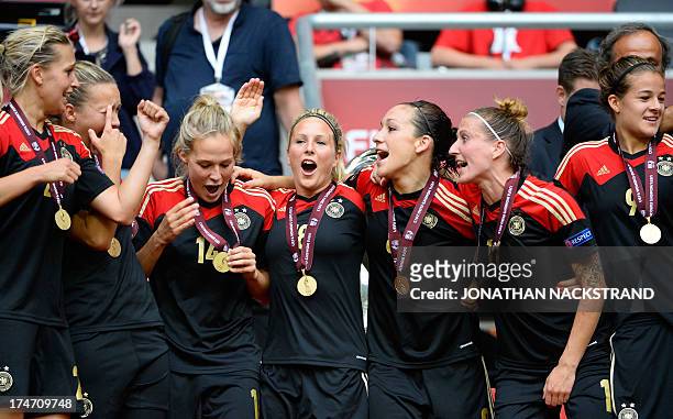 Germany's players celebrate after winning the UEFA Women's European Championship Euro 2013 final Germany vs Norway on July 28, 2013 in Solna, Sweden....